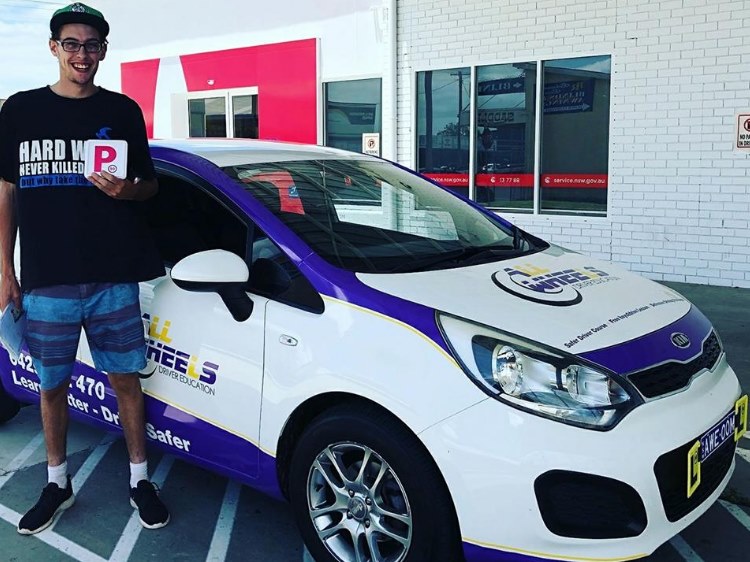 Image may contain: 1 person, smiling, car and outdoor