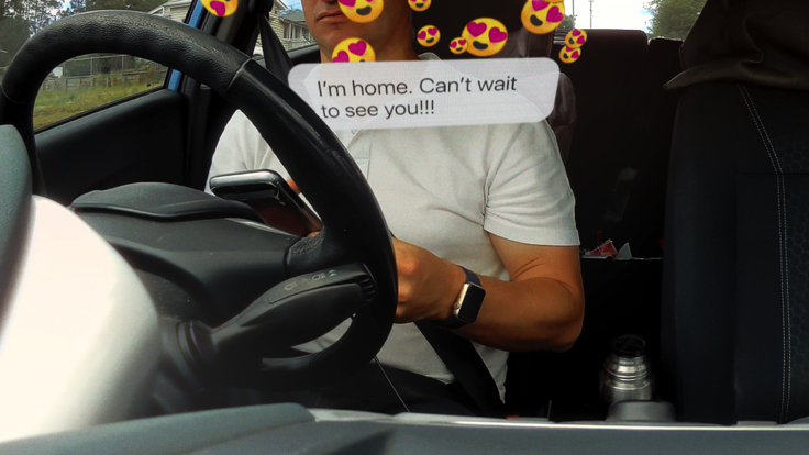 Road-safety illustration of a driver looking at a phone with message notifications overlaid.