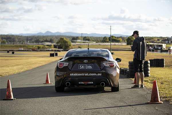 An instructor directing a customer on a Corporate Driver Training day.