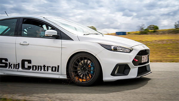 A white car parked on track.