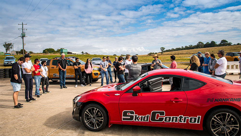 A white car parked on track.