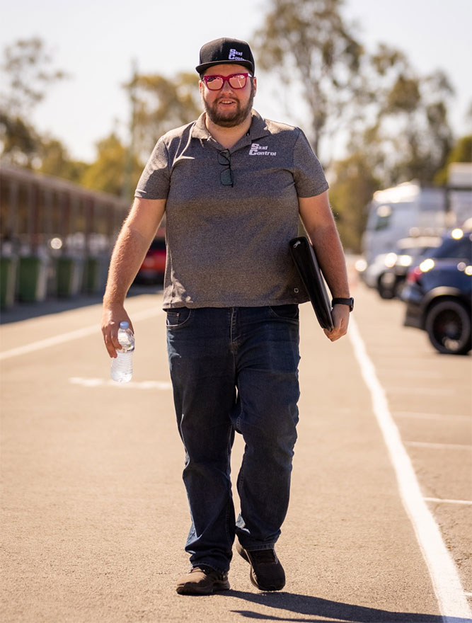 Professional Instructor, Kester Ward, walking forwards on a track.