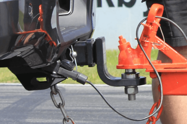 Close up of a trailer hitched to a tow bar.
