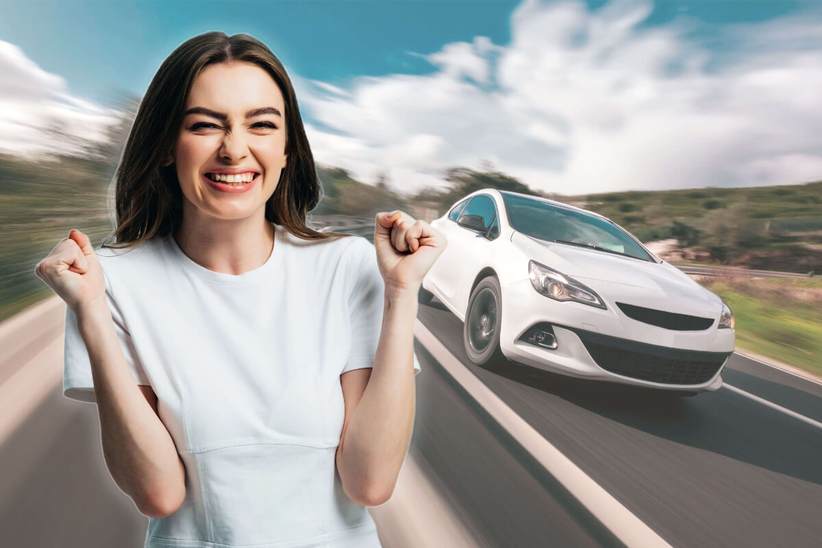 An excited woman celebrates as a white car drives past.