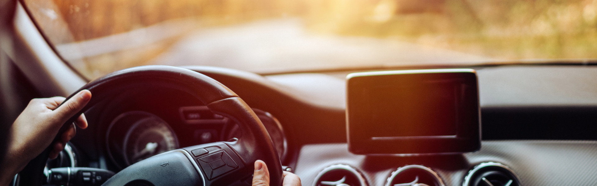 A happy student on a driving lesson with AAPEX Driving Academy.