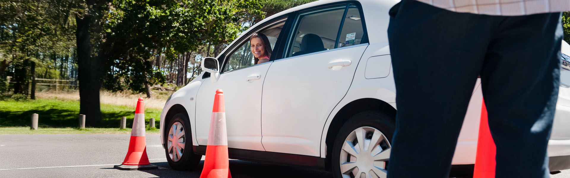 A happy student on a driving lesson with AAPEX Driving Academy.
