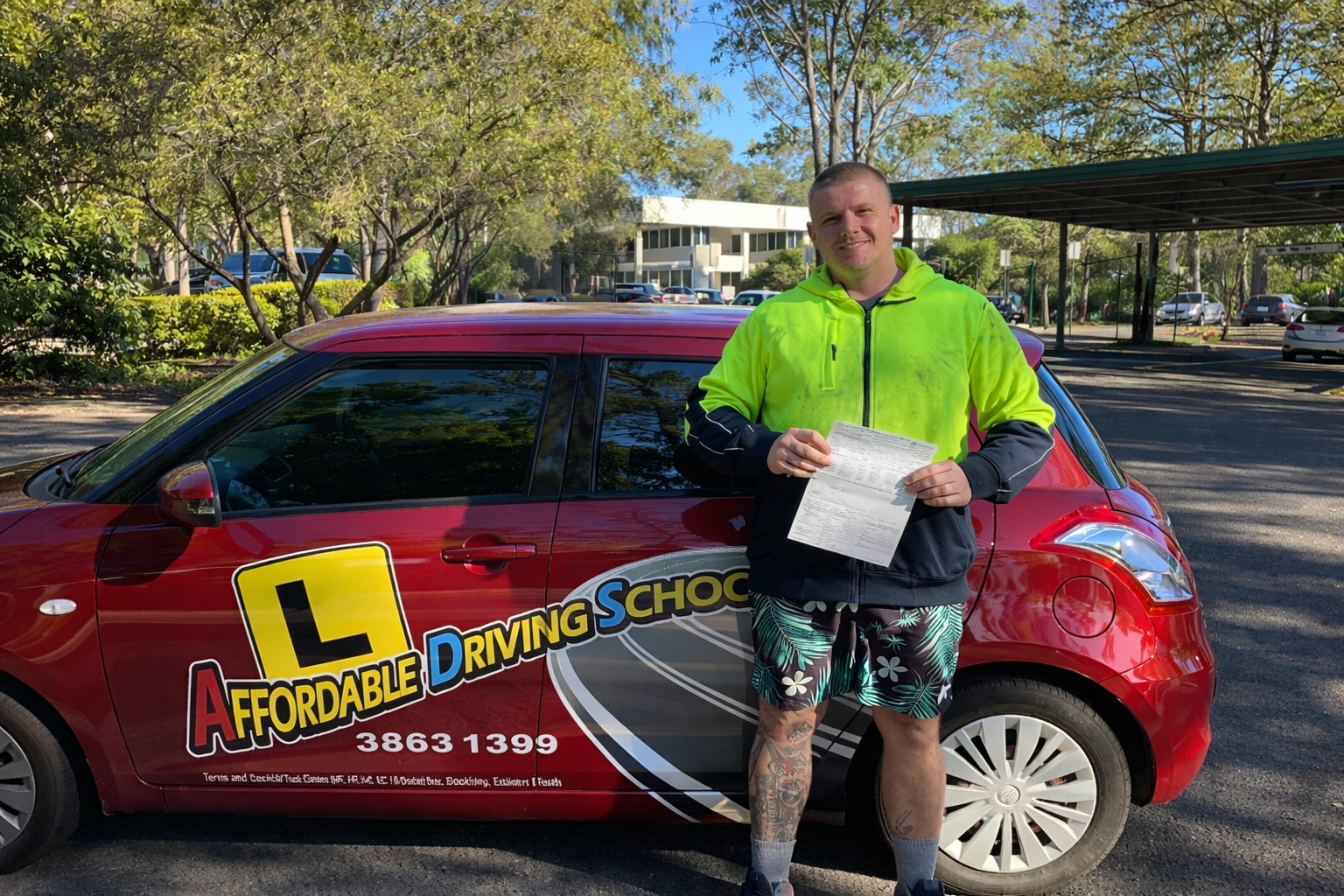Driving instructor assisting a student in Acacia Ridge