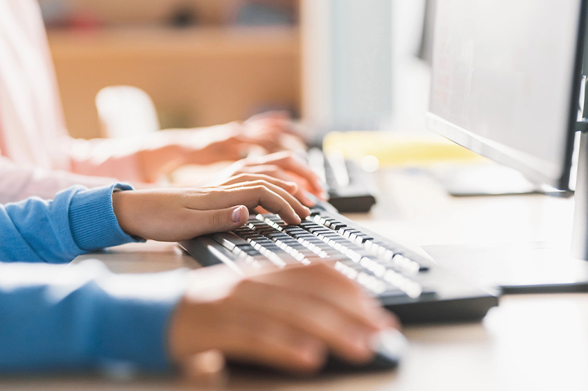Happy student studies in a classroom session.