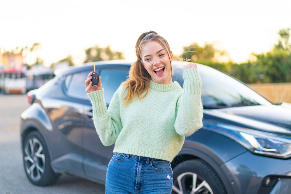 Happy student on driving lesson.