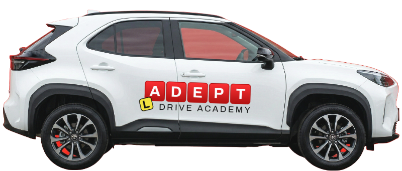 Side view of white Adept Drive Academy car.