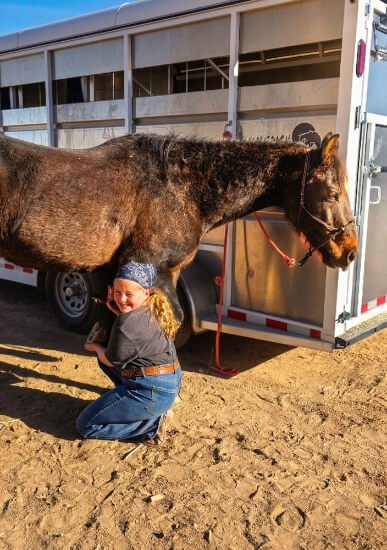 Horse being unloaded from trailer at K&J Horse Boarding.