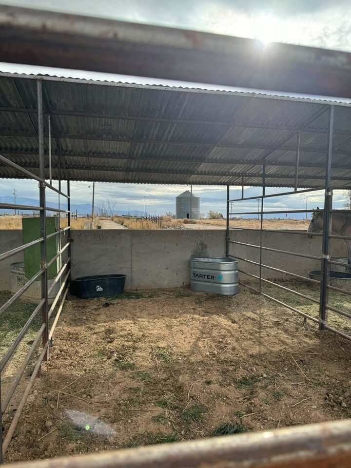 Covered pen with water trough.