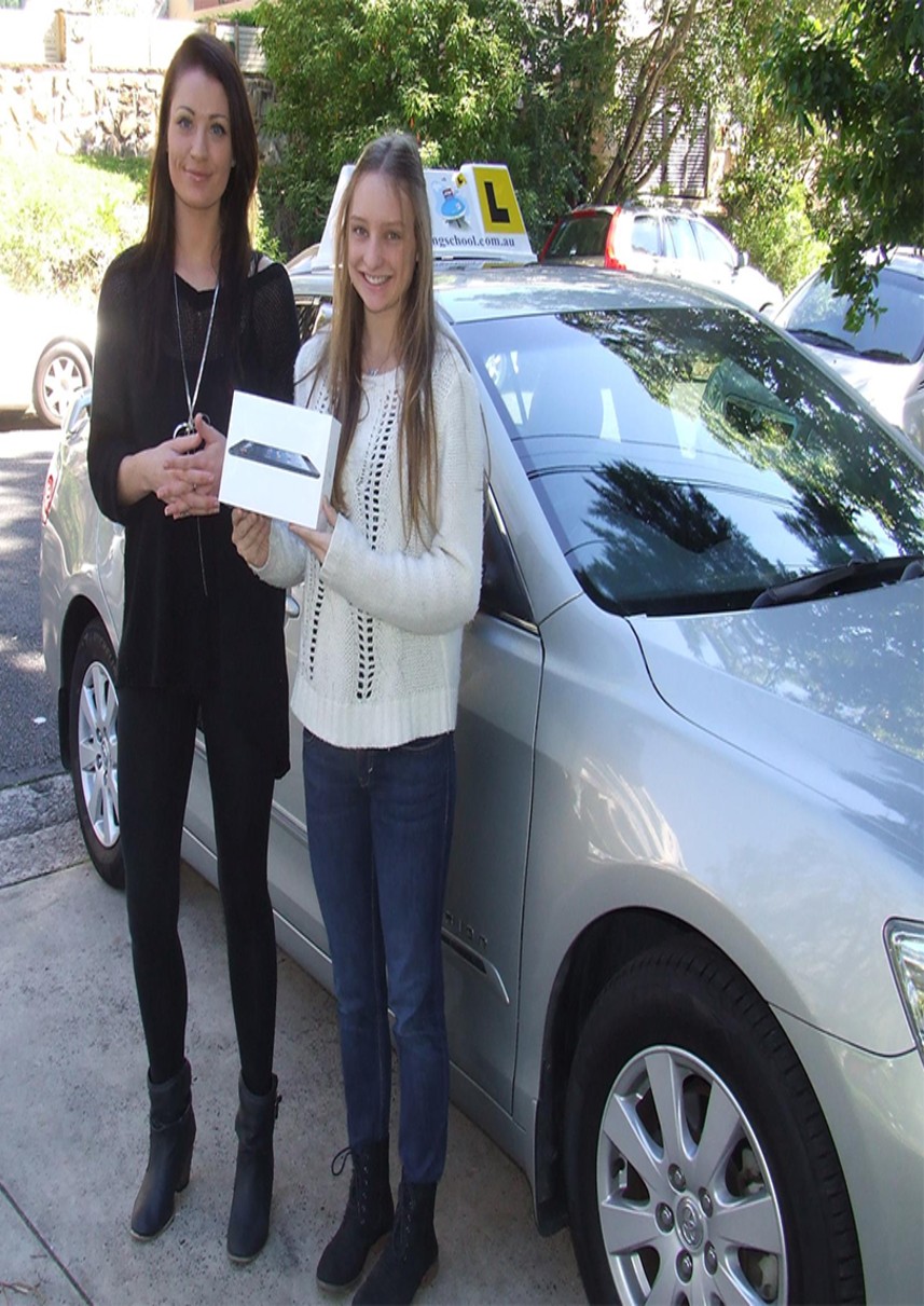 Happy student with P plates &mdash; become a driving instructor and help learners pass their NSW driving test on Sydney's North Shore
