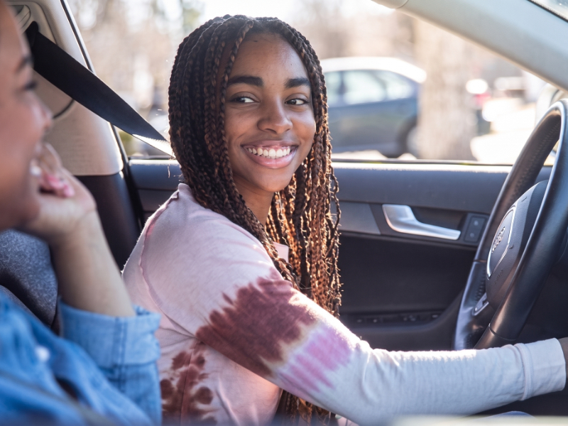 A driving student receiving real-time vehicle guidance during a dedicated behind-the-wheel lesson.