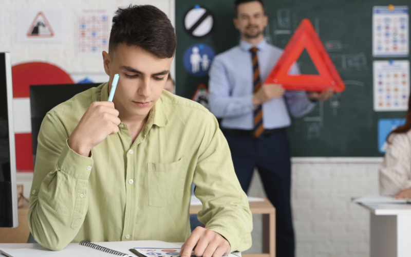Student concentrating while on a New York Driver Improvement Program lesson.
