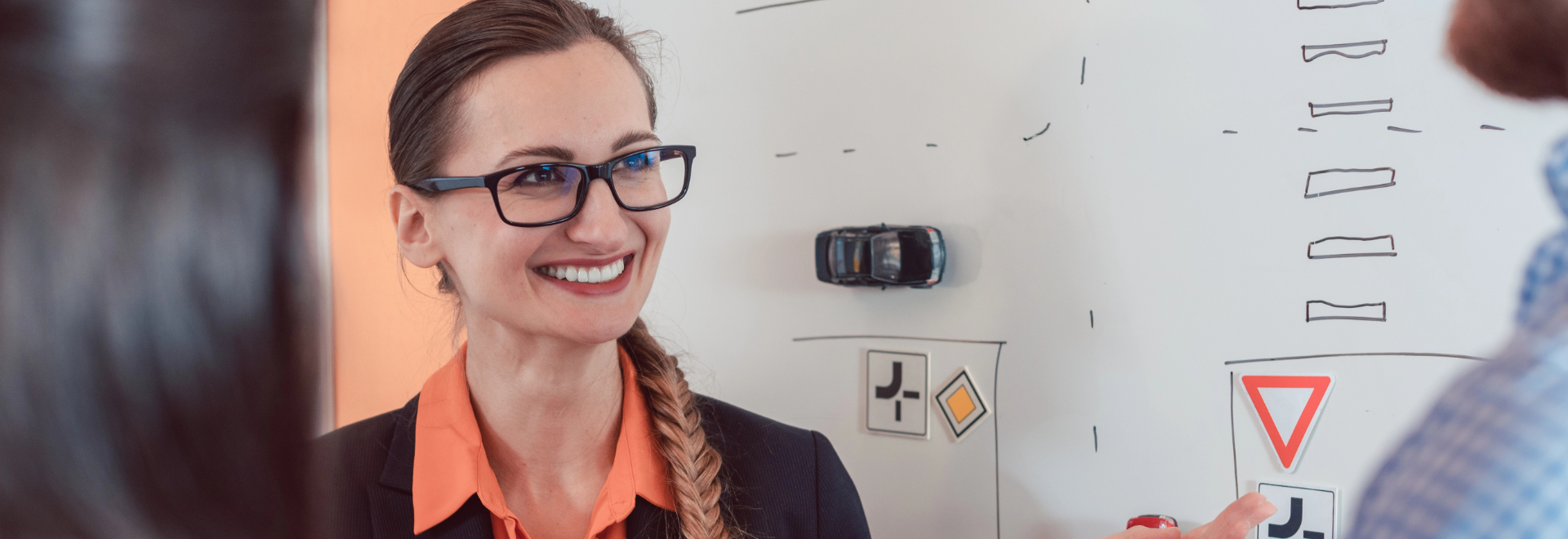 Smiling instructor on an Instructor-led RoadWise lesson.