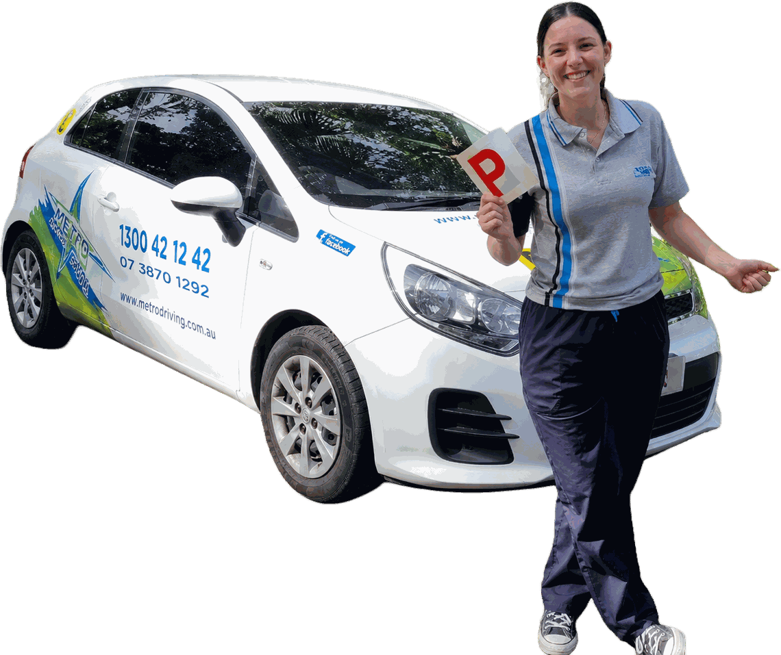 A Metro instructor holding a P-plate beside a Metro learner car