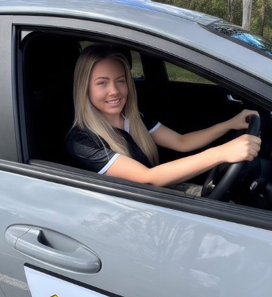 Driver seated at the wheel of a lesson car